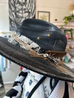 Wide brim black fedora hat with gold stars