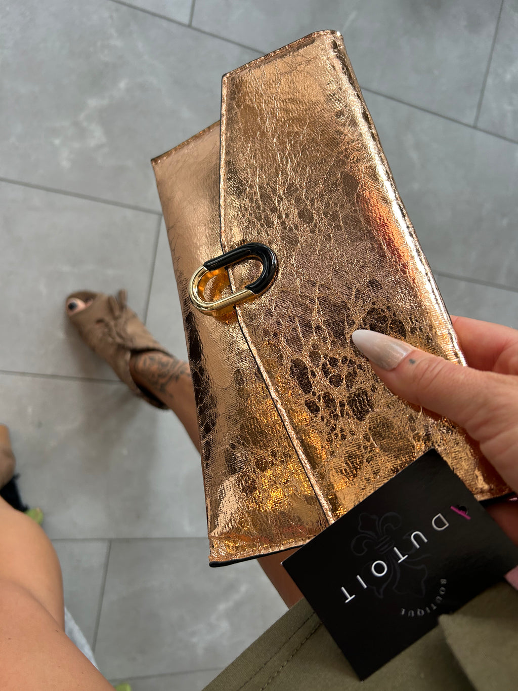 Metallic rose gold clutch